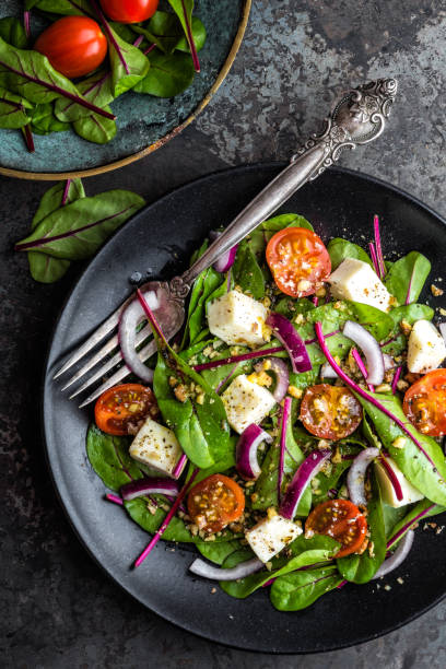 istock plate of nutritious simple salad with chard, walnuts, soft cheese, onions and oil 920464984