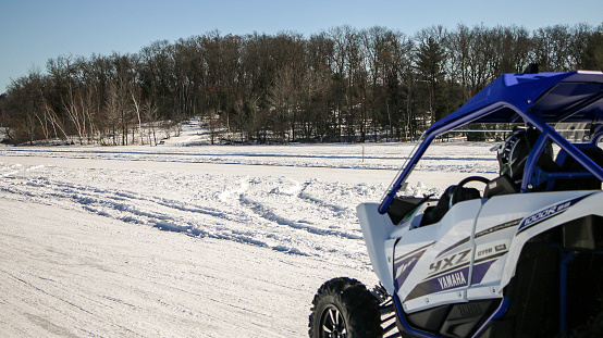 Crivitz, Wisconsin - USA - February 10, 2018: People enjoying our annual winter event on High Falls Flowage. People come from all over to run the radar run with their snow machines. ATVs, Snowmobiles, Side by sides, etc. They also come to try and win the Fish-O-Rama. Sponsored by Twin Bridge Water Ski Club.