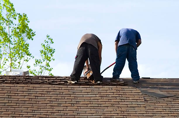 istock Roofers Putting Shingles on a Roof 92046996