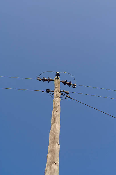 Utility pole with insulator pins stock photo
