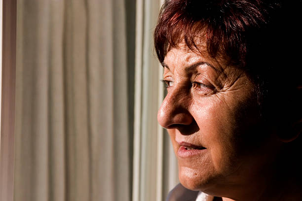 istock Woman looking out the window 92048210