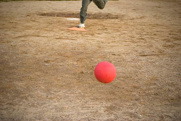 レッドキックボールアプローチ - playground schoolyard playful playing ストックフォトと画像