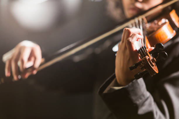 istock Mixed race teenage boy playing the violin 920484784