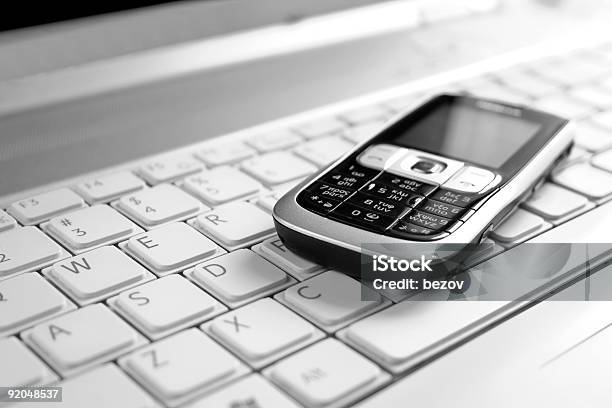 Business Concept Includes A Laptop And Cell Phone Stock Photo - Download Image Now - Backgrounds, Black Color, Close-up