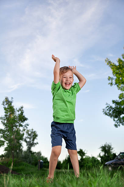 istock Happy little boy waving with his hands 92048543