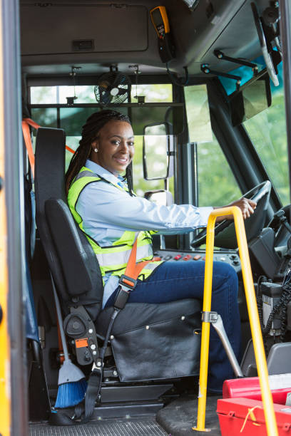 istock School bus driver looking through doorway 920488592