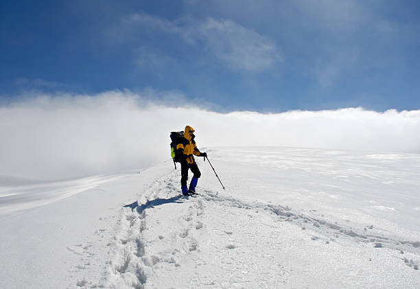 istock Lonely climber on  top of mountain 92048933