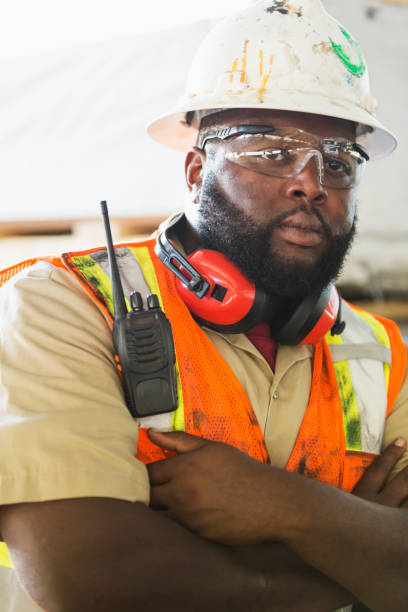 istock African-American worker in hardhat, reflective vest 920495854