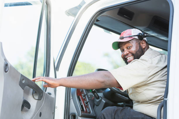 istock African-American truck driver in driver's seat 920496540