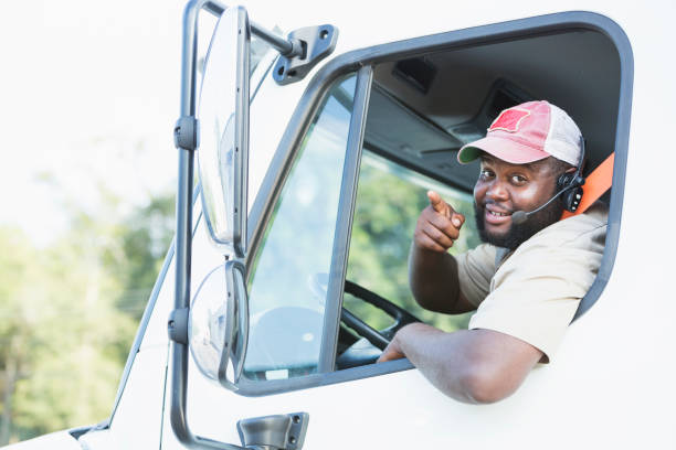 istock African-American truck driver in driver's seat 920496576