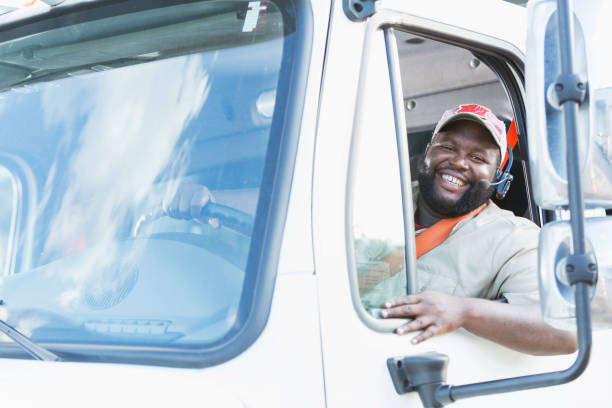 istock African-American truck driver in driver's seat 920496608