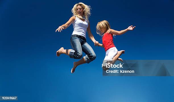 Flying Foto de stock y más banco de imágenes de Trampolín - Artículos deportivos - Trampolín - Artículos deportivos, Familia, Madre