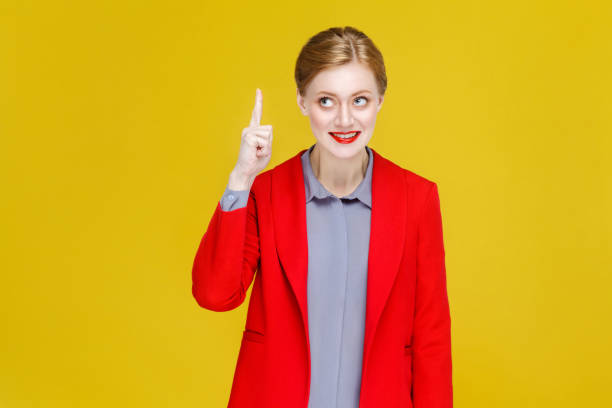 istock Ginger red head business woman in red suit have good plan, idea. 920497604