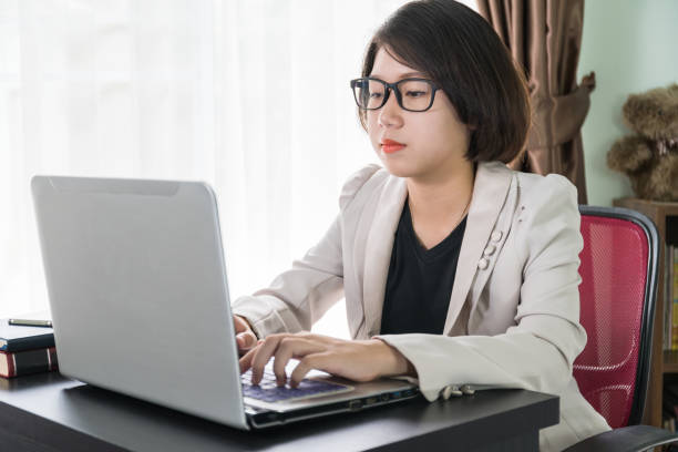 istock Woman working on laptop in home office 920497792