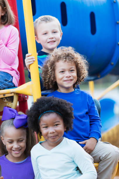 istock Multi-ethnic preschool children on playground 920497944