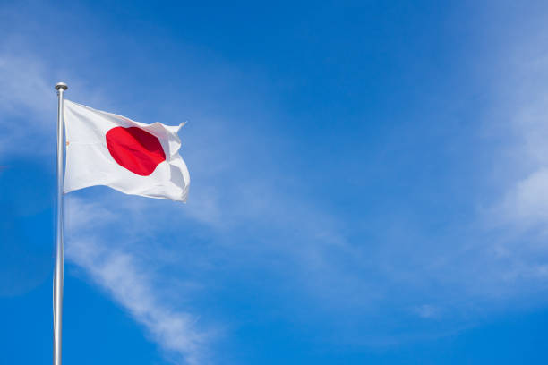 istock Flag of Japan in blue sky background. 920498028