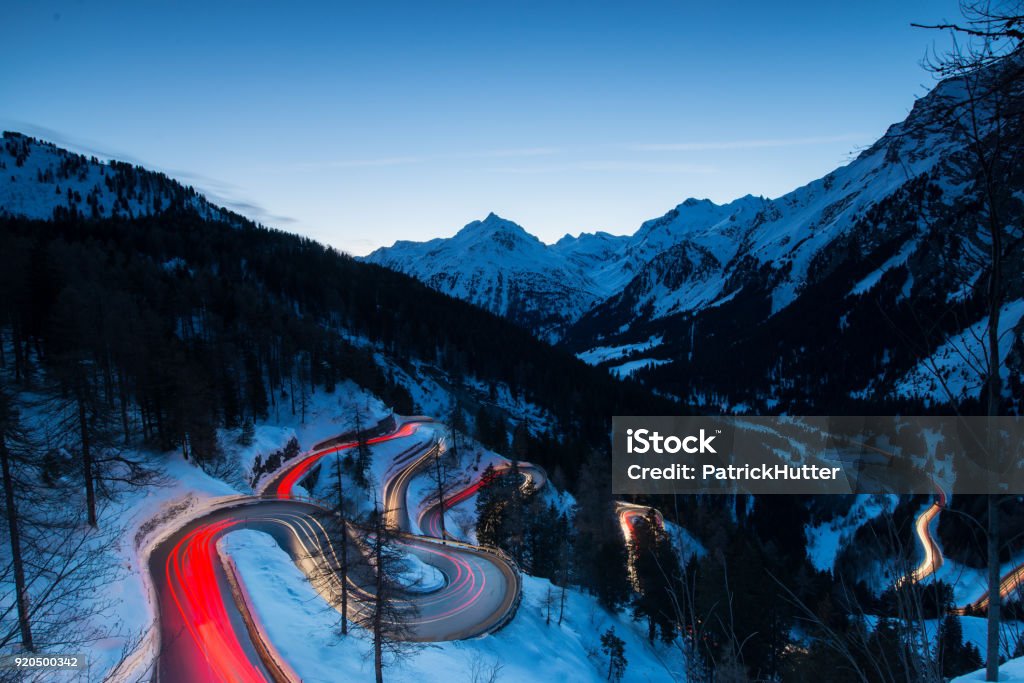 Maloja Pass Maloja Pass is a high mountain pass in the Swiss Alps in the canton of Graubuenden in Switzerland. Car Stock Photo