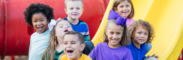 istock Multi-ethnic school children on playground 920503132