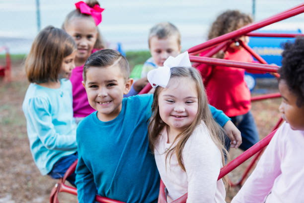 istock Multi-ethnic school children on playground monkey bars 920506900
