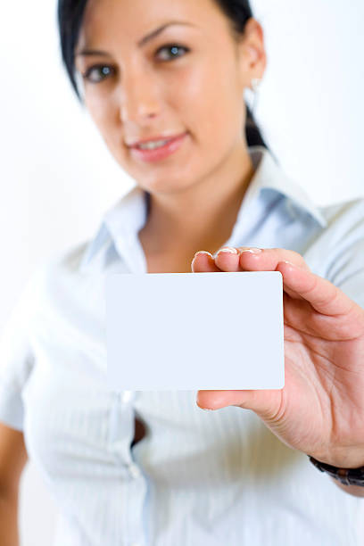 istock attractive businesswoman holding a blank card 92050910