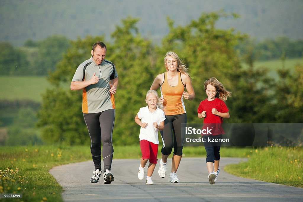 Family jogging outdoors  Exercising Stock Photo