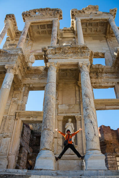 istock a tourist man is taking Ephesus Celsus Library's photo 920516222