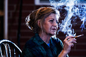 Senior woman smoking a cigarette