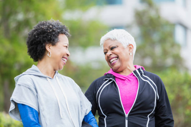istock Two African-American women laughing together 920522034