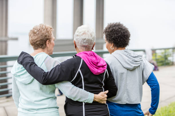 Three older multi-ethnic women hanging out together
