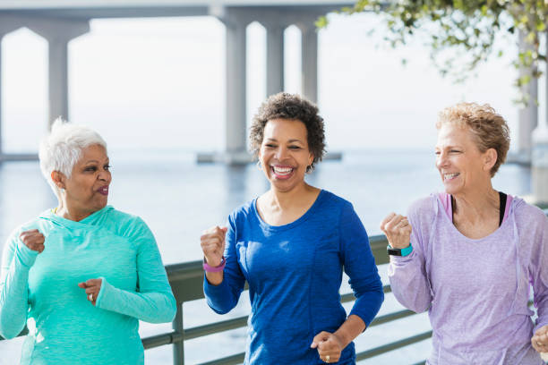 istock Three mature and senior women running on waterfront 920525084