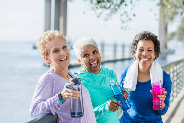istock Three mature and senior women exercising on waterfront 920525088