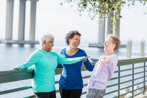 istock Three mature and senior women exercising on waterfront 920525104