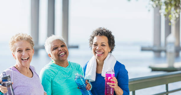 istock Three mature and senior women exercising on waterfront 920525118