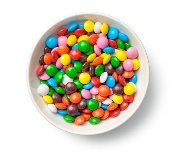 istock Colorful Chocolate Candy Pills in Bowl Isolated on White Background 920525222