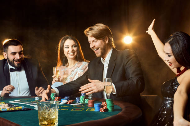 istock Upper class friends gambling in a casino 920531972