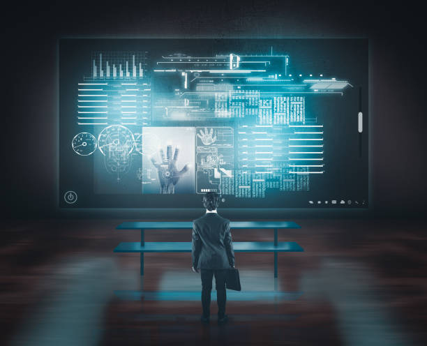 istock Businessman watching big touch screen above the desk. 920534496