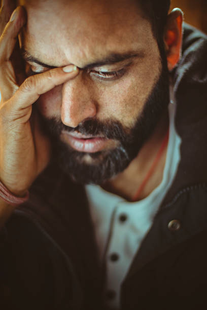 istock Sad mid adult man thinking at home. 920534510