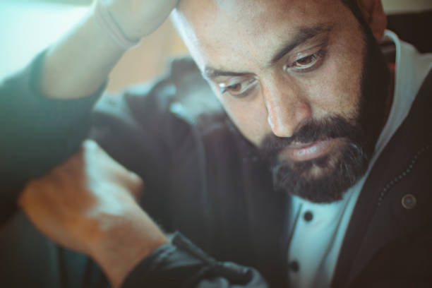 istock Sad mid adult man thinking at home. 920534514