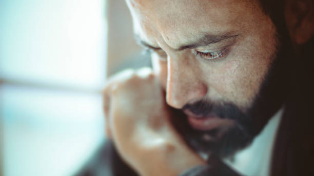 istock Sad mid adult man thinking at home. 920534516
