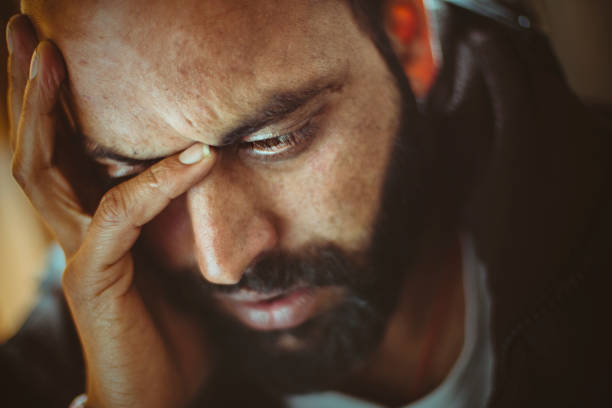 istock Sad mid adult man thinking at home. 920534522