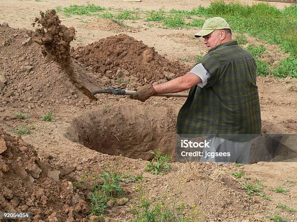 Rugged Man Digging Deep Hole With Shovel Stock Photo - Download Image Now - Digging, Hole, Yard - Grounds