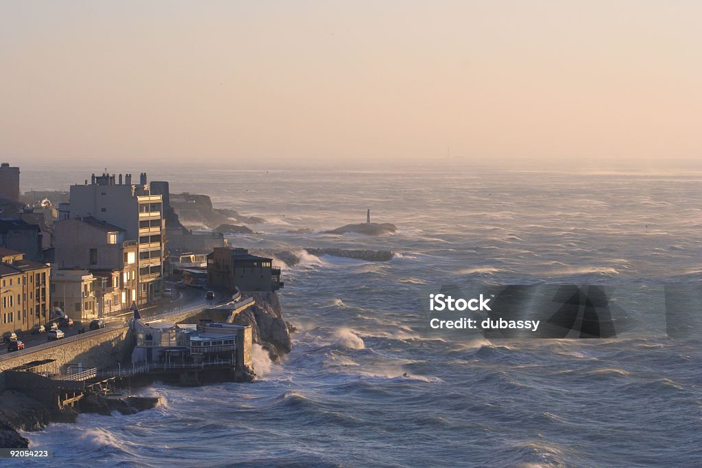 corniche dusk sunset arrving on the marseille corniche after a storm Breaking Wave Stock Photo