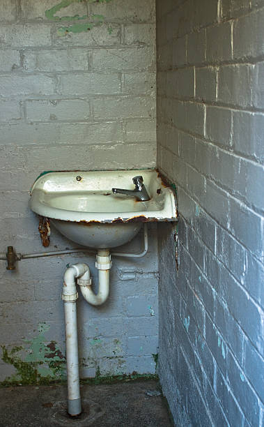 istock Old public washroom with dirty sink, with copy space 92054469