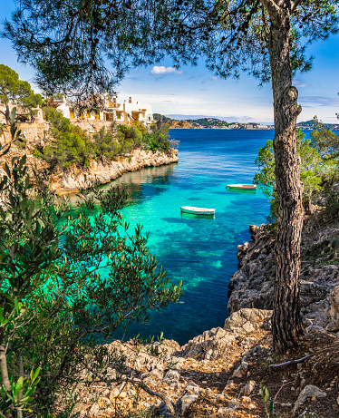 Two boats in beautiful bay of Cala Fornells on Mallorca, Spain Mediterranean Sea