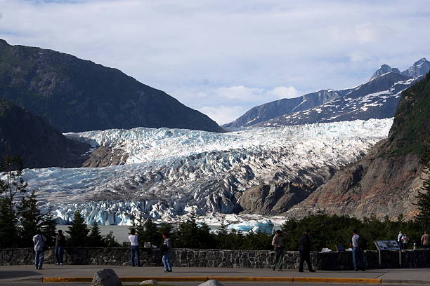 Tourists view the glacier stock photo