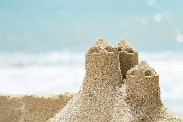 istock Sand castle standing on the beach. Travel vacations concept. 920580930