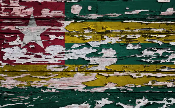 Photo of Togolese flag painted on a grunge plank