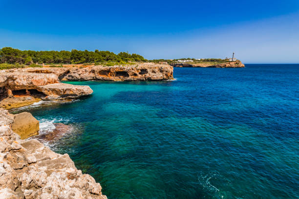 istock Island scenery on Majorca, beautiful coastline with lighthouse in Portocolom, Spain 920600174