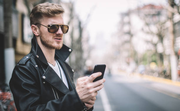 istock Man texting on the street 920605406
