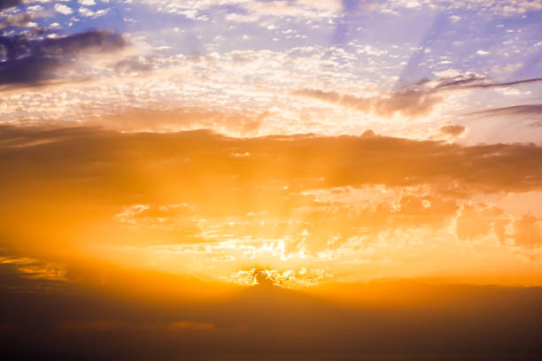 istock Colorful bright sunset or sunrise with sun rays and clouds 920606814
